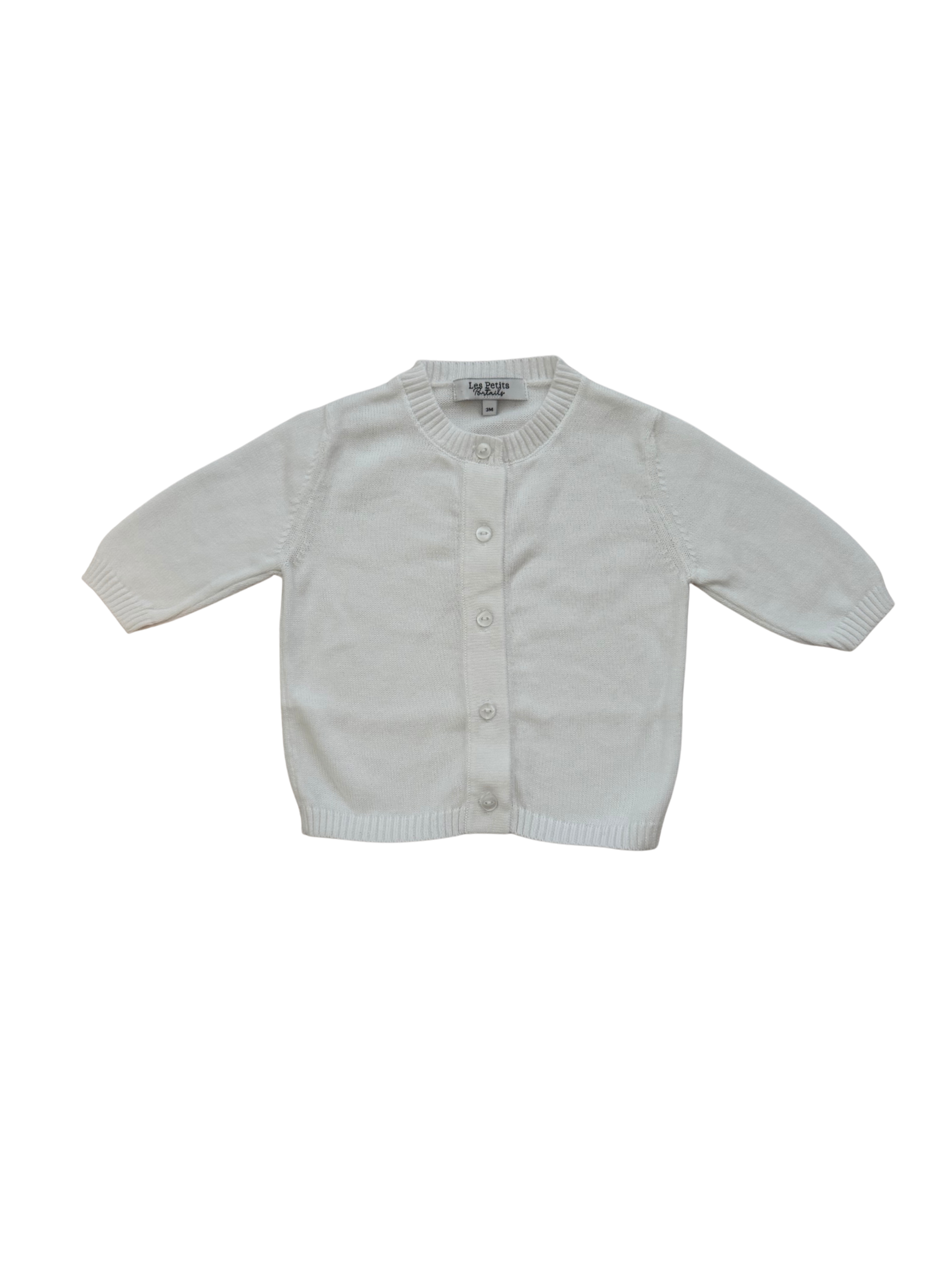 A white long-sleeve knit cardigan sweater for toddlers, featuring a button-up front and ribbed collar, cuffs, and hem, laid flat against a white background.